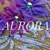 Логотип телеграм канала @aurora45ru — Купальники для художественной гимнастики "Aurora"