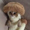 Логотип телеграм канала @cozyhomey — карамельная свечка ୨୧вязание крючком୨୧