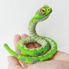 Логотип телеграм канала @reptilii_amigurumi — Рептилии, динозавры, драконы Амигуруми