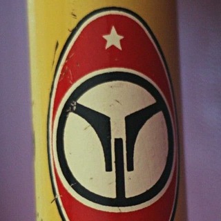 Логотип телеграм канала @tacyclopedia — Тахион