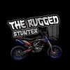 Логотип телеграм канала @theruggedstunter — The Rugged Stunter